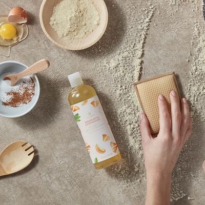 Thymes Mandarin Coriander All Purpose Cleaning Concentrate for Floors and Surfaces with messy kitchen background